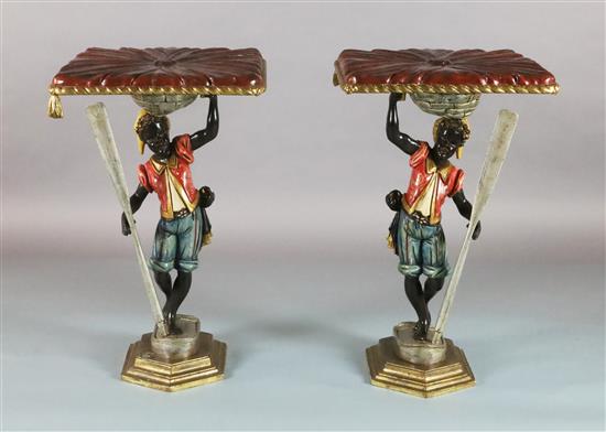 A pair of late 19th century Florentine carved and painted wood blackamoor occasional tables, W.1ft 8in. D.1ft 8in. H.2ft 8in.